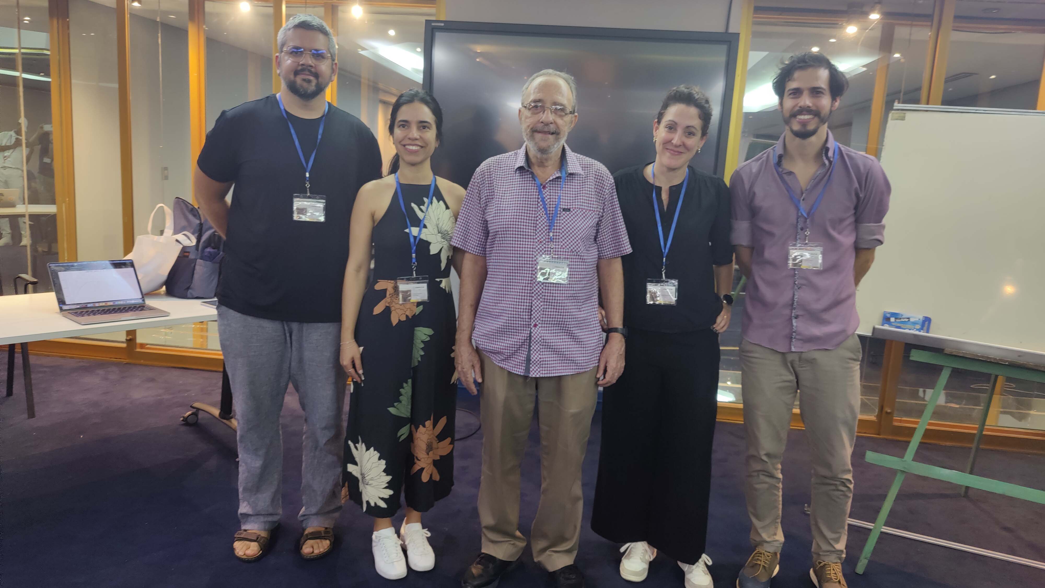 Professor José E. Valdés (center) with four of his past students. All were participants at the School.