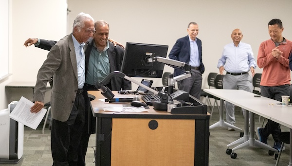 Georgia Tech Professor Sham Navathe retirement celebration embrace