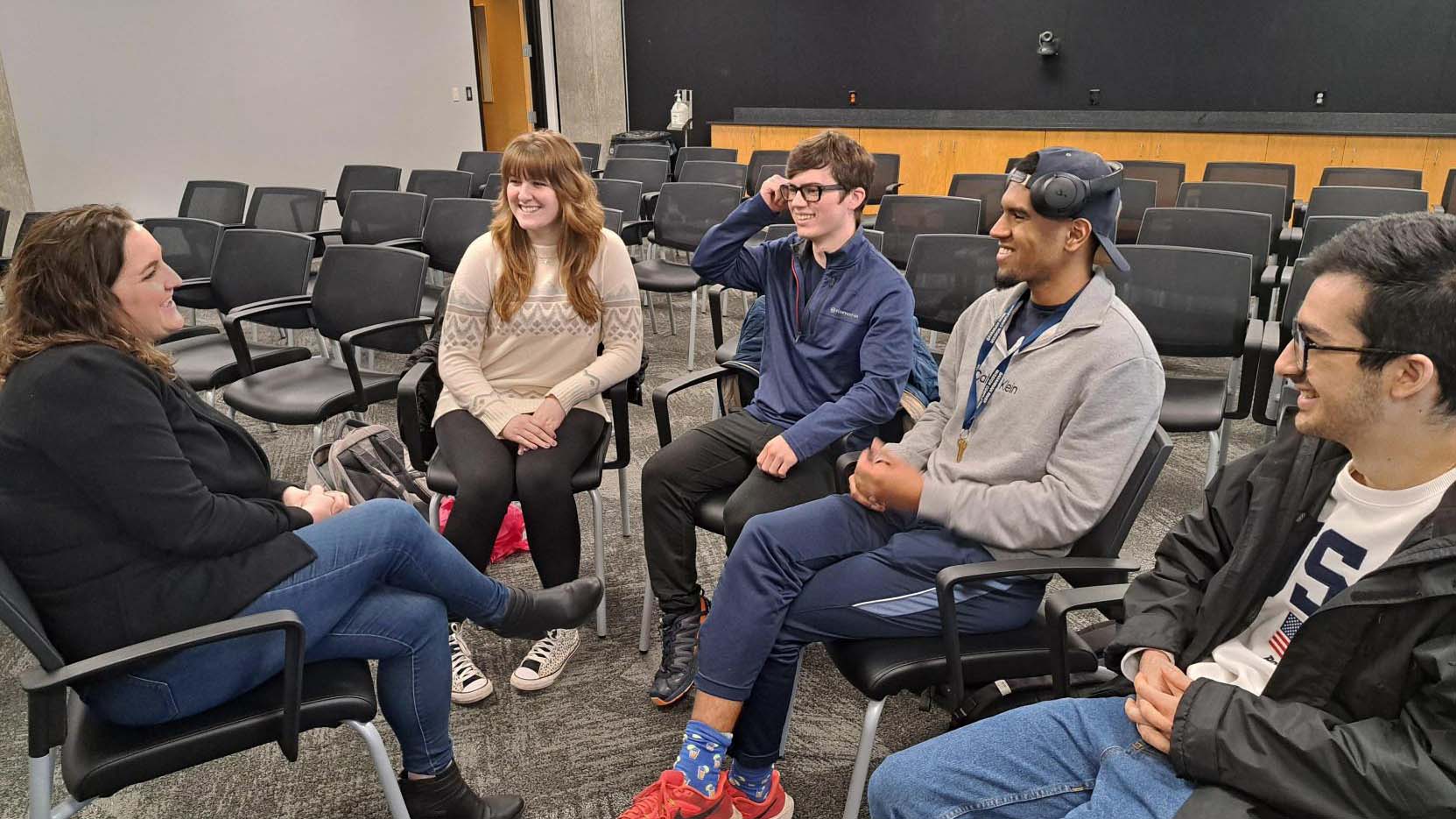 Whitlow mentors a student group on their startup for the course.