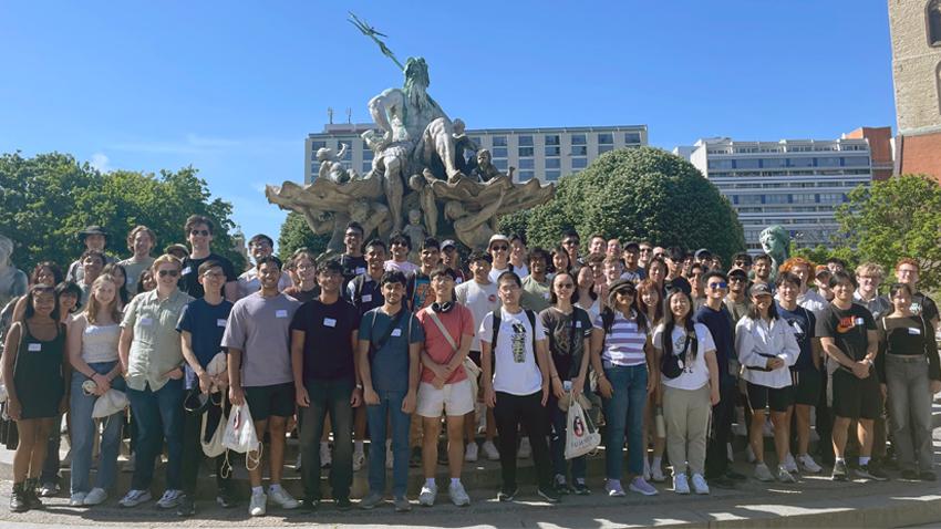 Students standing in front of the Fountain of Neptune in Berlin