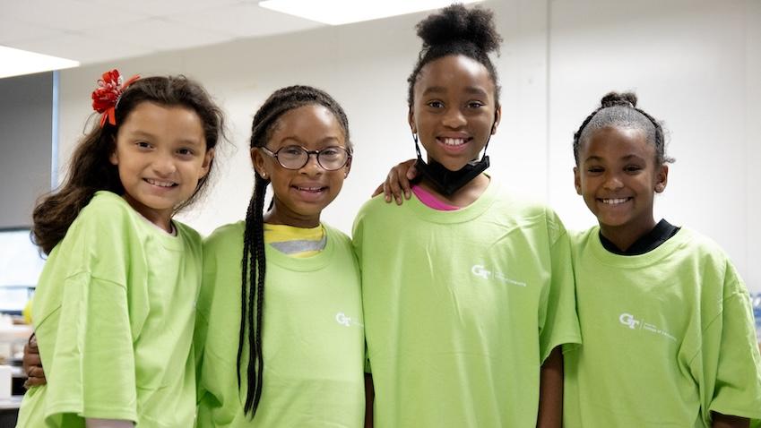 Group photo of US Virgin Islands elementary-school age students participating in a computing summer camp hosted by Georgia Tech's Constellations Center for Equity in Computing