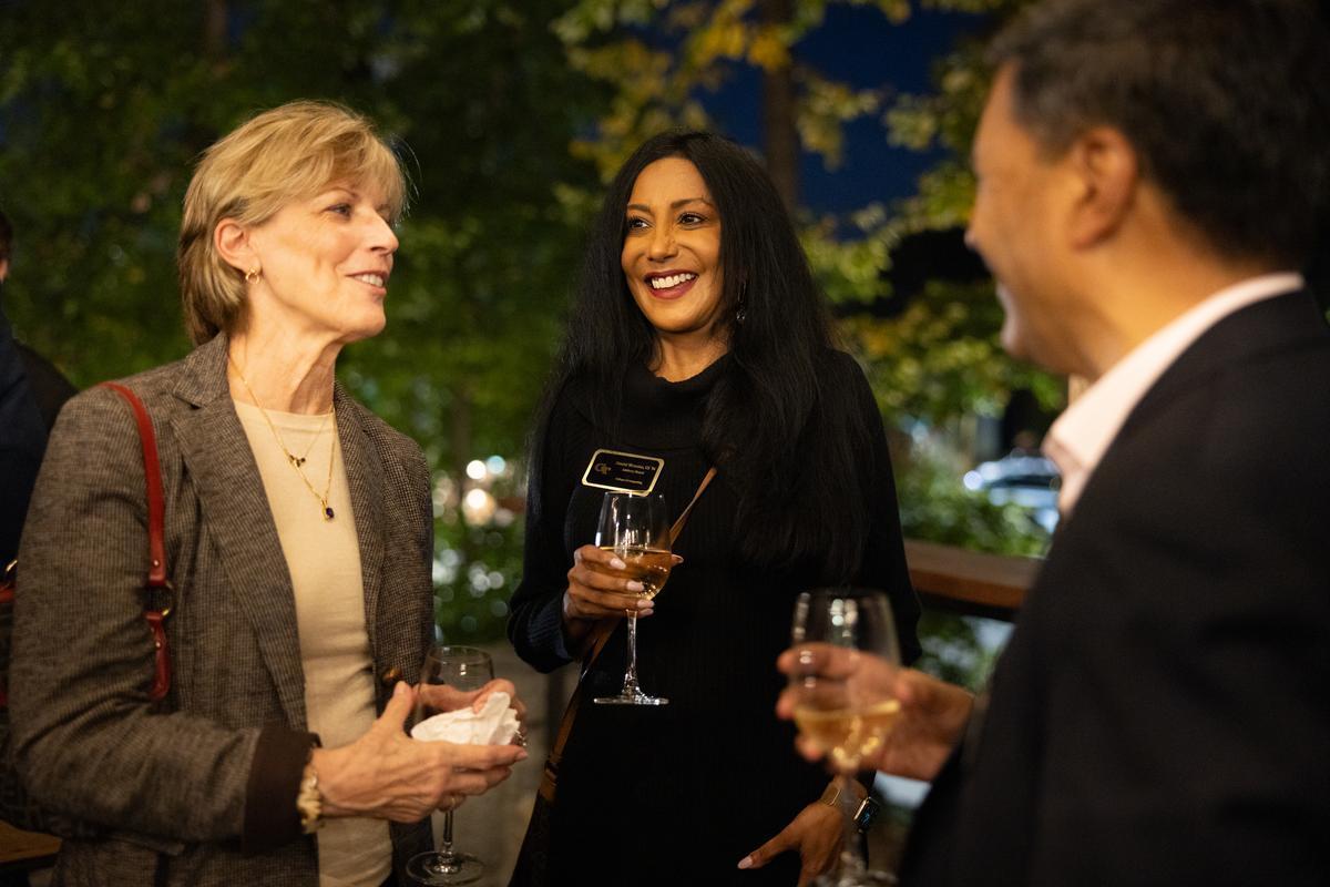 Alumni talking to the dean